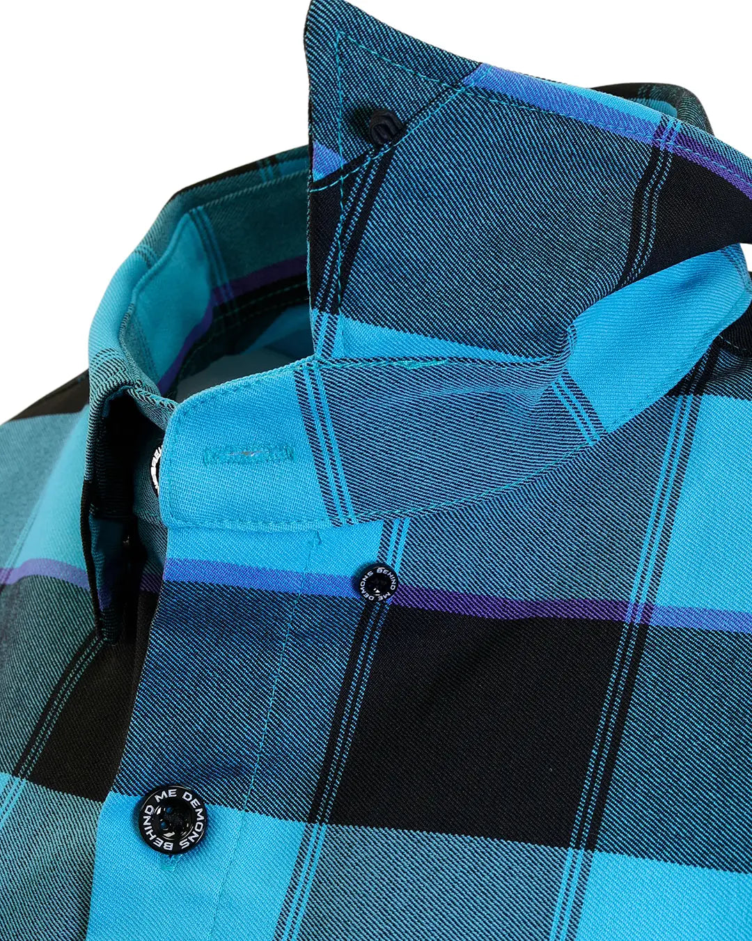 Close-up of “Survivor 2.0” flannel button-down collar and plaid fabric