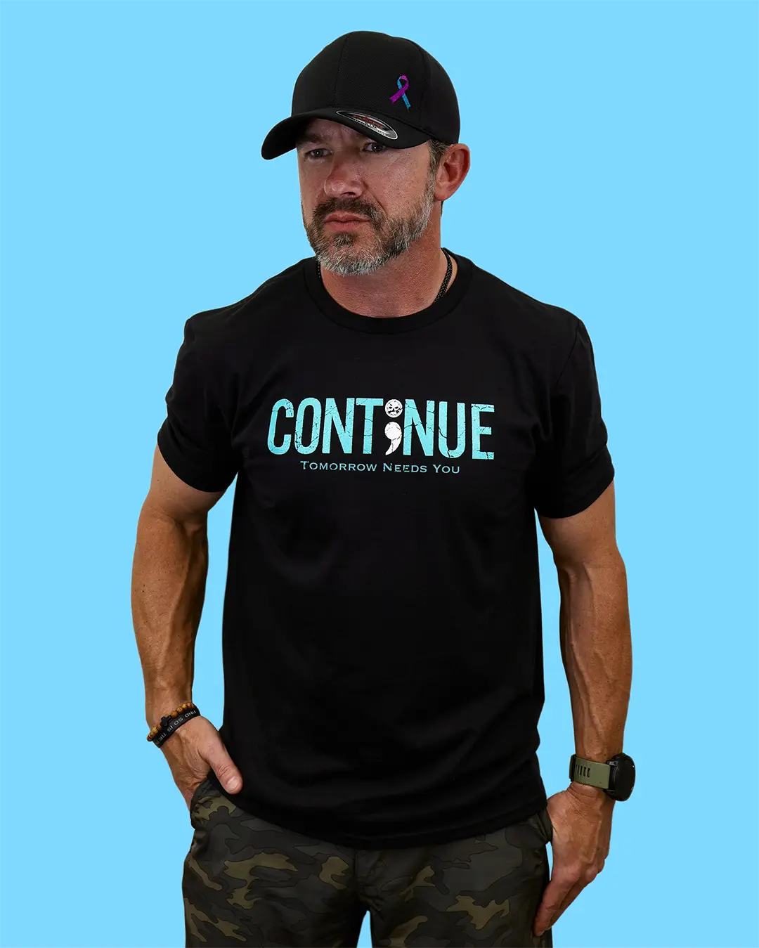Man wearing black “Continue” suicide prevention T-shirt