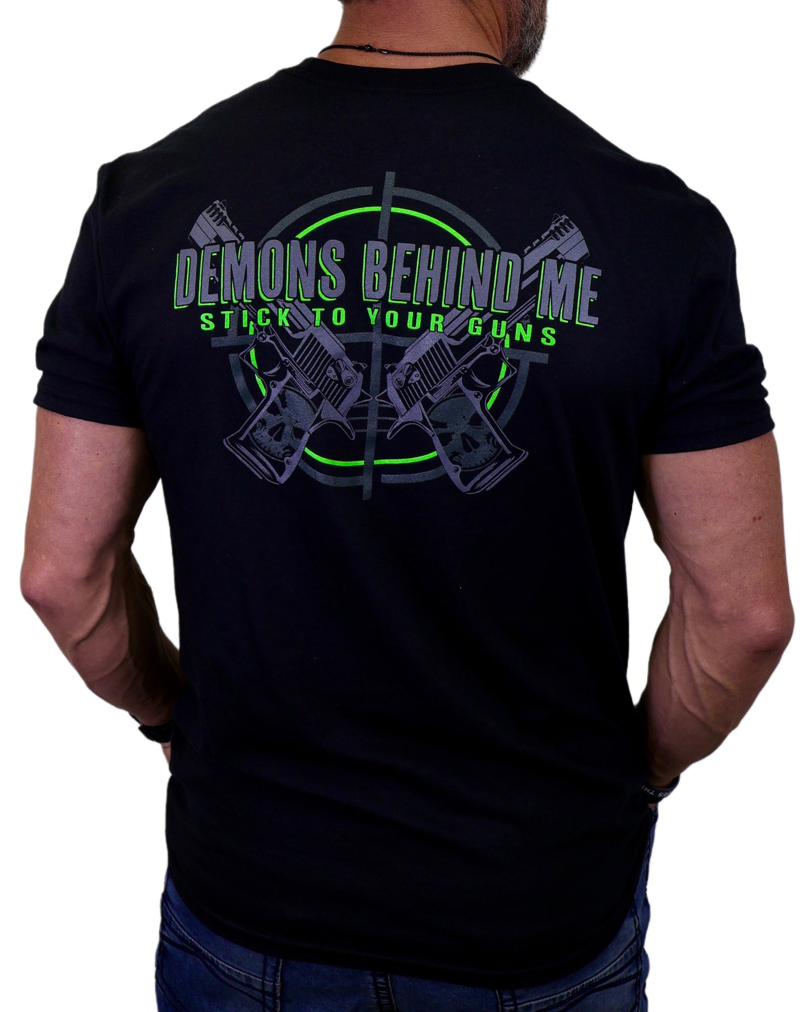 Black t-shirt with graphic design and text on the back, worn by a person.