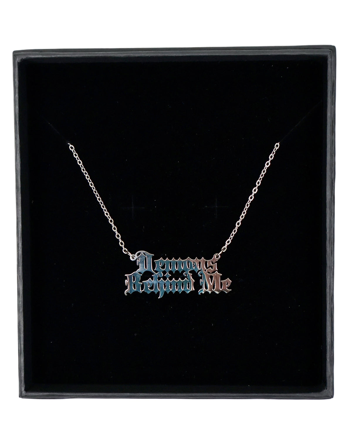 Necklace with 'Demons Behind Me' pendant in a black box