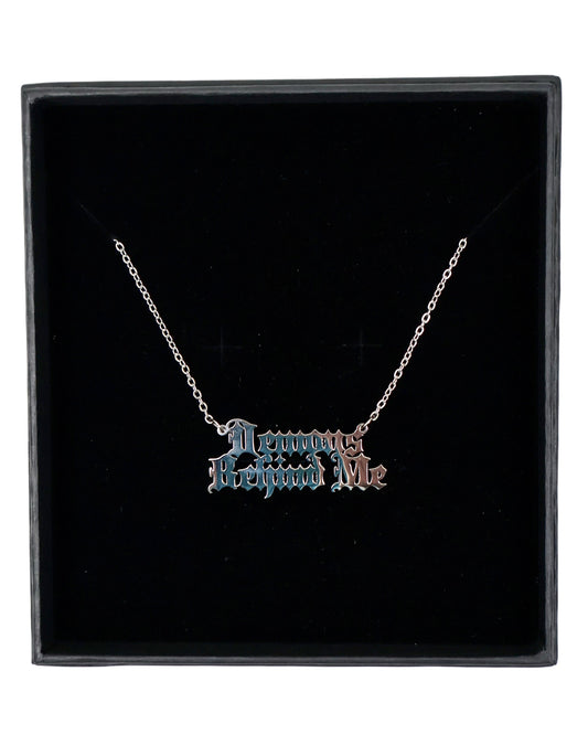 Necklace with 'Demons Behind Me' pendant in a black box