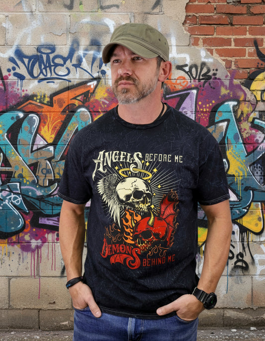 Man wearing a black t-shirt with a graphic design and a cap on a white background