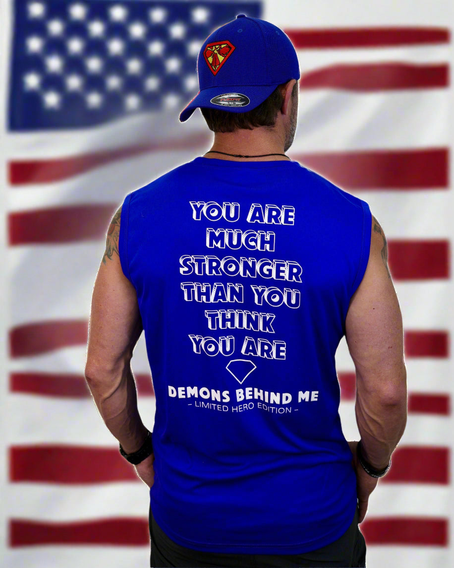 Person wearing a blue sleeveless shirt with motivational quote and a blue cap with a logo.