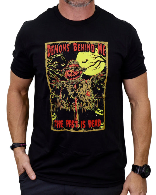 Black t-shirt with a graphic design featuring a pumpkin and text on a white background