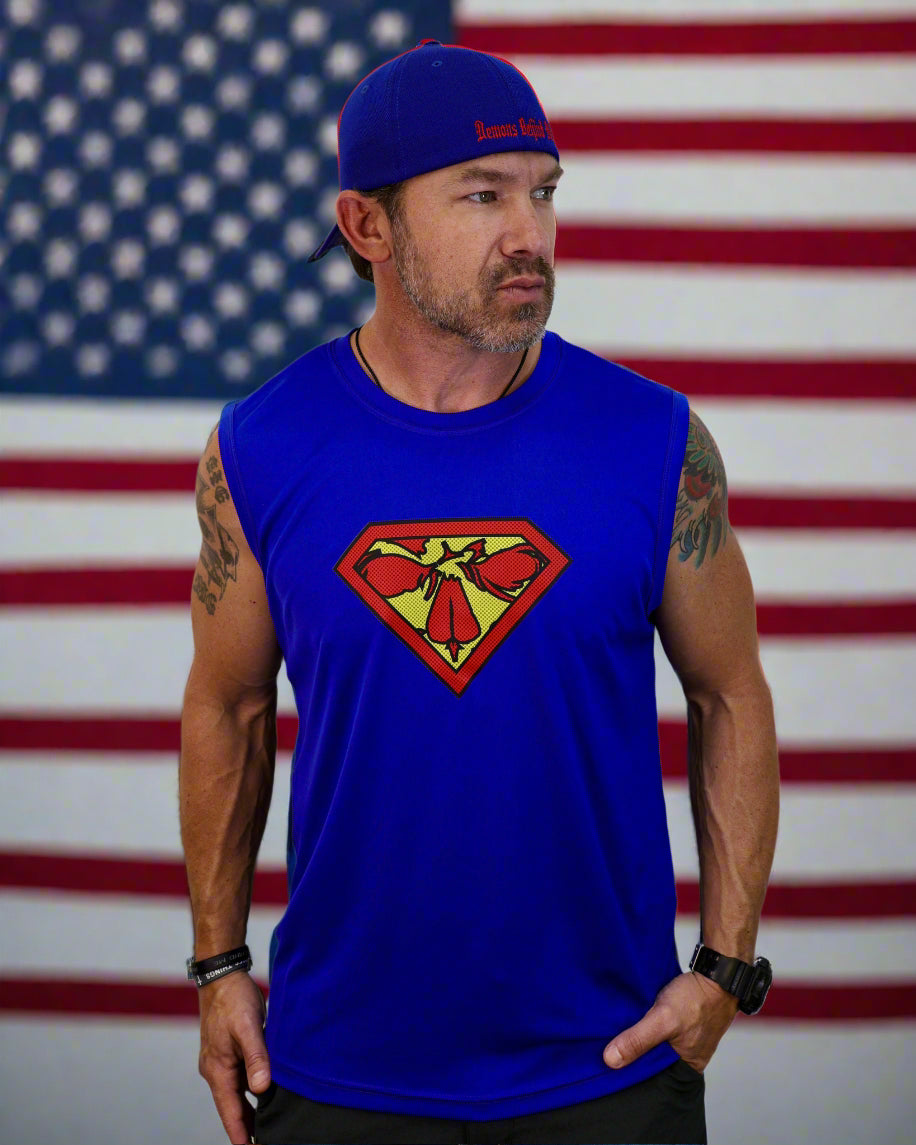 Man wearing a blue sleeveless shirt with a Superman logo and a blue cap on a white background