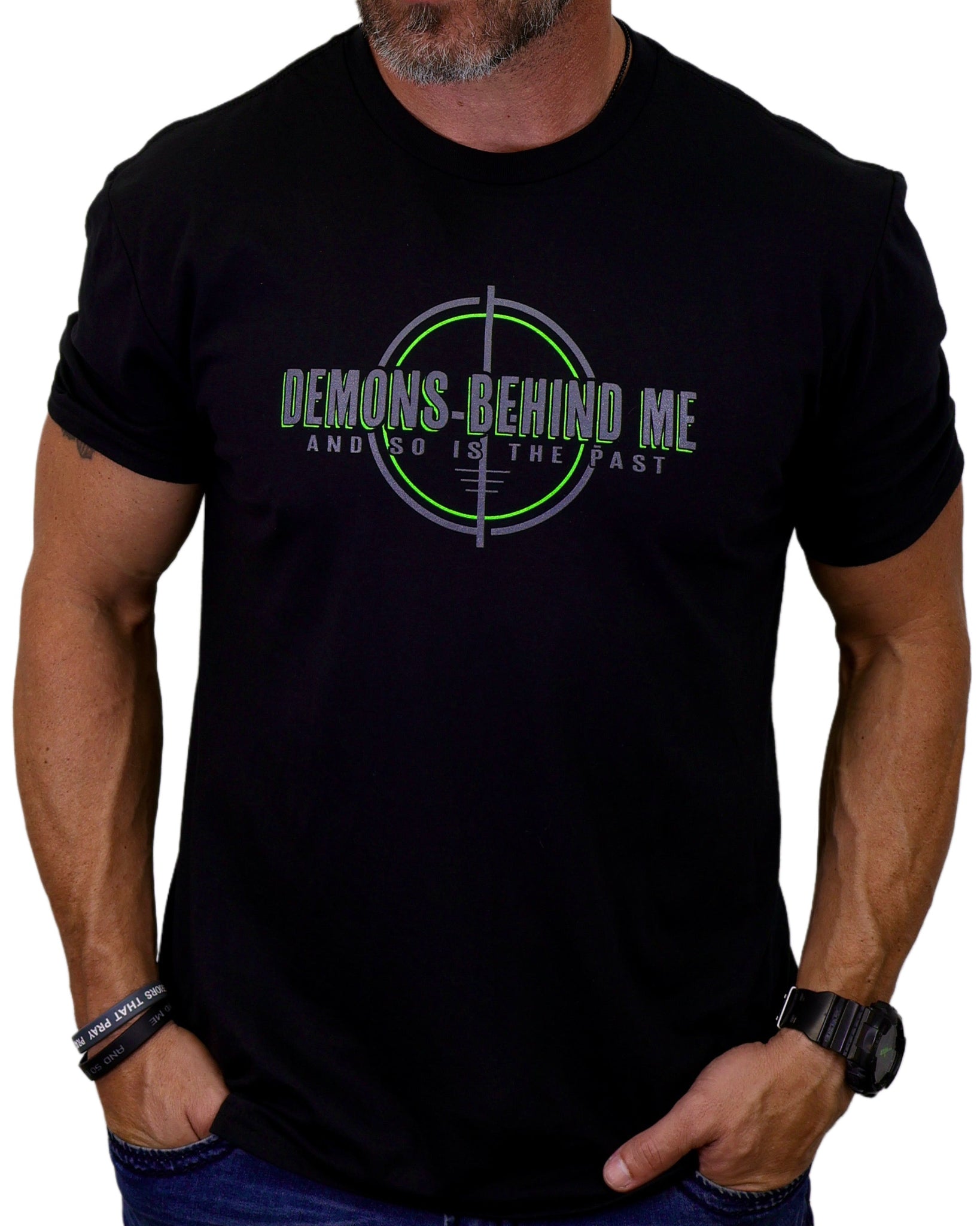 Person wearing a black t-shirt with a graphic design and text.