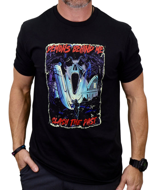 Black t-shirt with a graphic design featuring a skull and text, worn by a person.