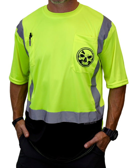 Person wearing a bright yellow safety shirt with a skull design on a white background