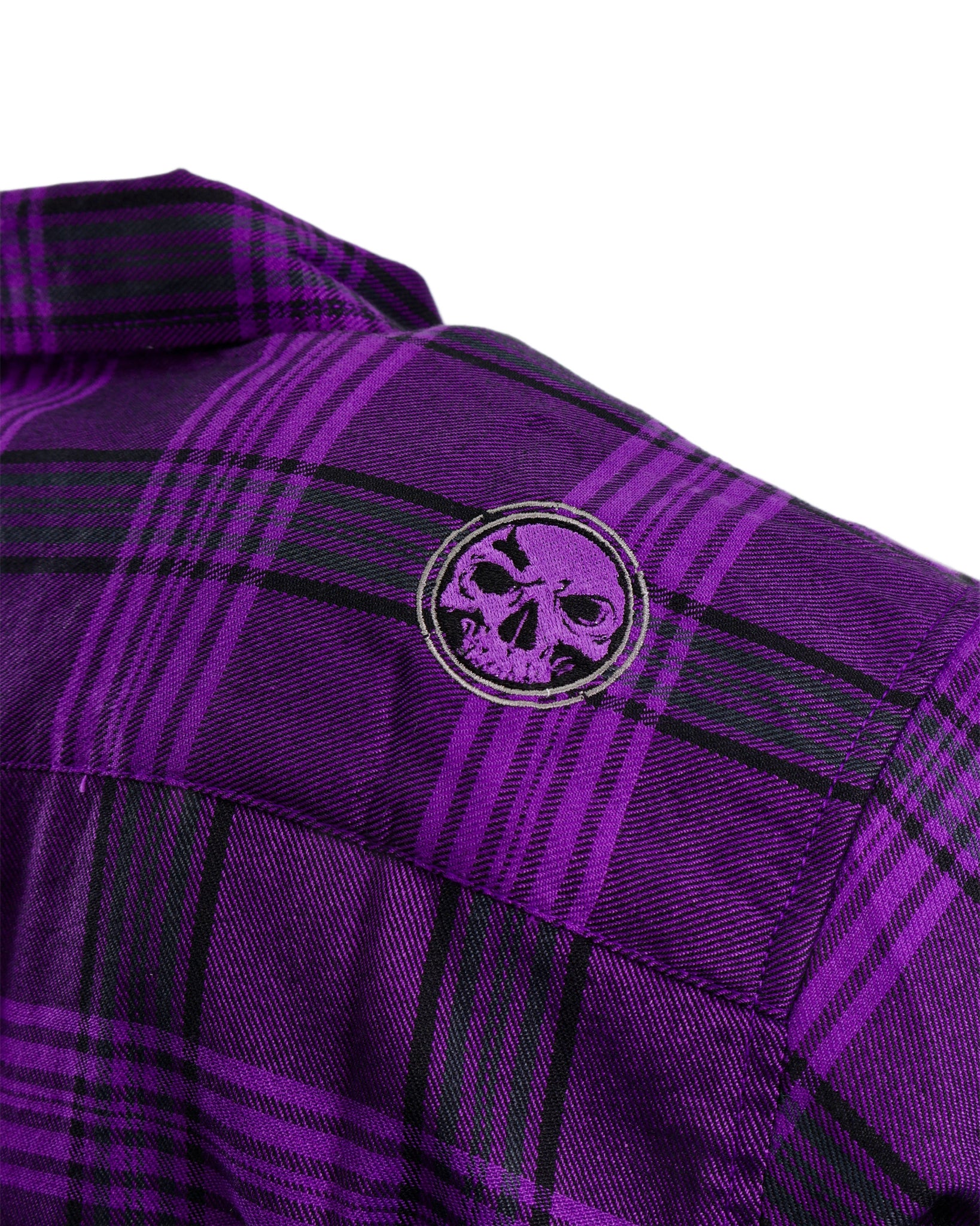 Purple plaid shirt with a skull emblem on a white background