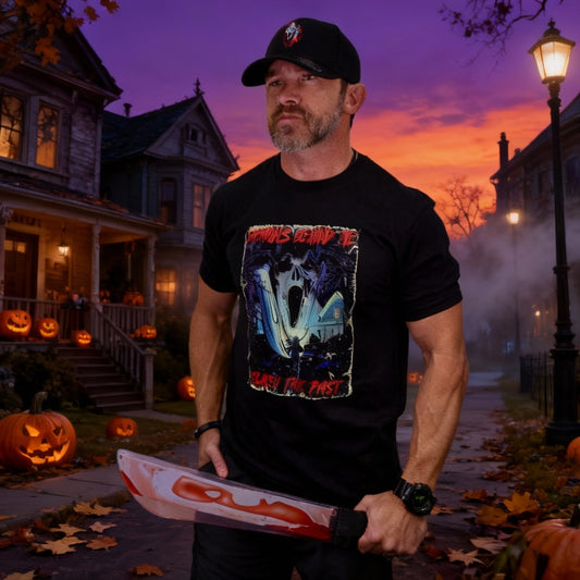 Man wearing a black t-shirt with a graphic design and holding a weapon on a white background