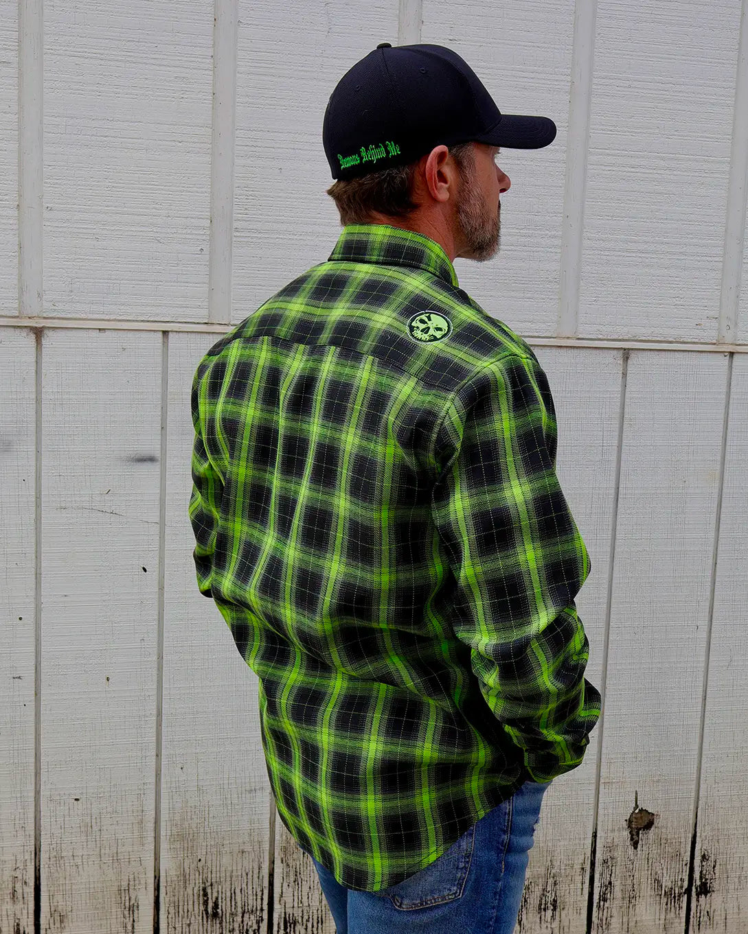 Model wearing the “Resurgence” 2.0 green and black plaid flannel, rear view