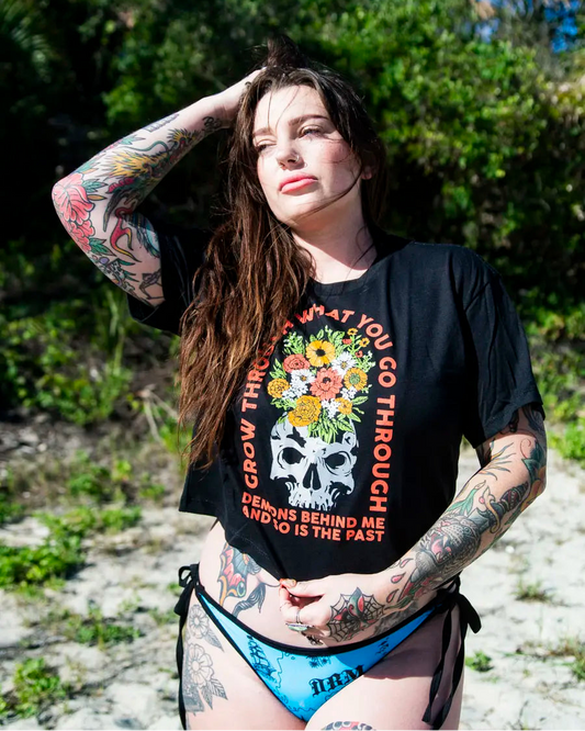 Model wearing black Demons Behind Me crop top