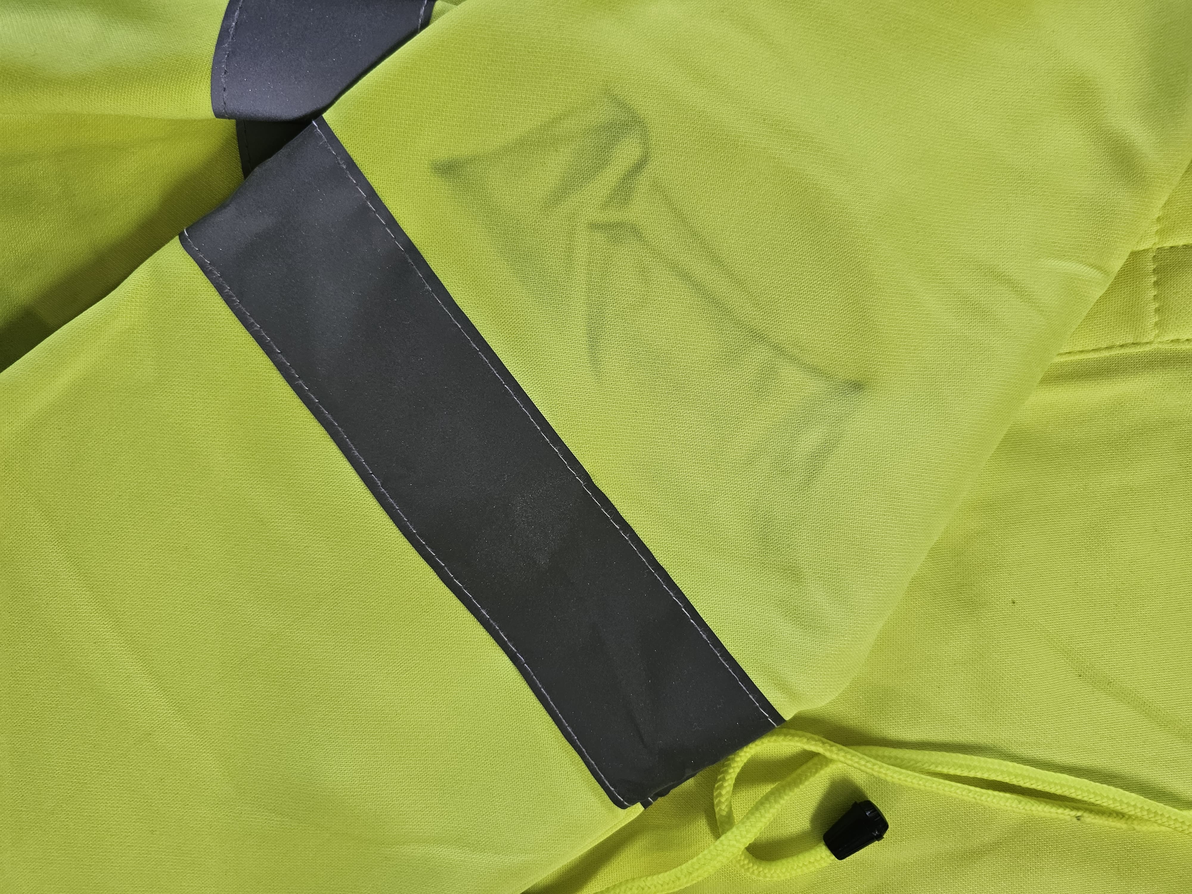 Premium Class 3 Hi-Vis Branded Hoodie hood detail showing documented black dye transfer on fluorescent yellow fabric